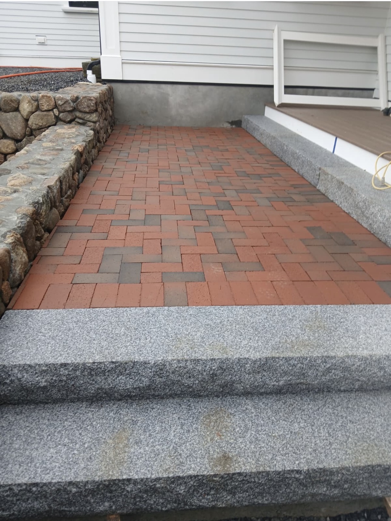 Outdoor flagstone patio installation in Wellesley MA by Castone Masonry